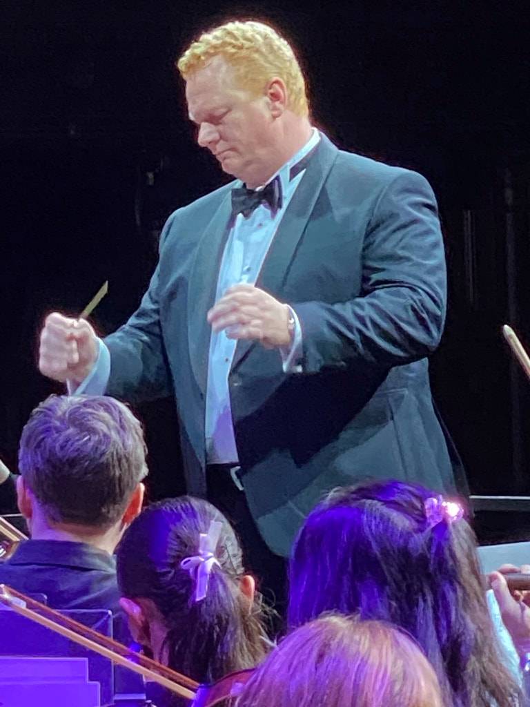 Warren Fisher conducting the massed choir